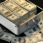 Grey Metal Case of Hundred Dollar Bills